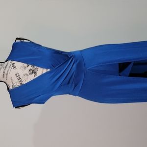 Blue form fitting romper with long flowing tail.